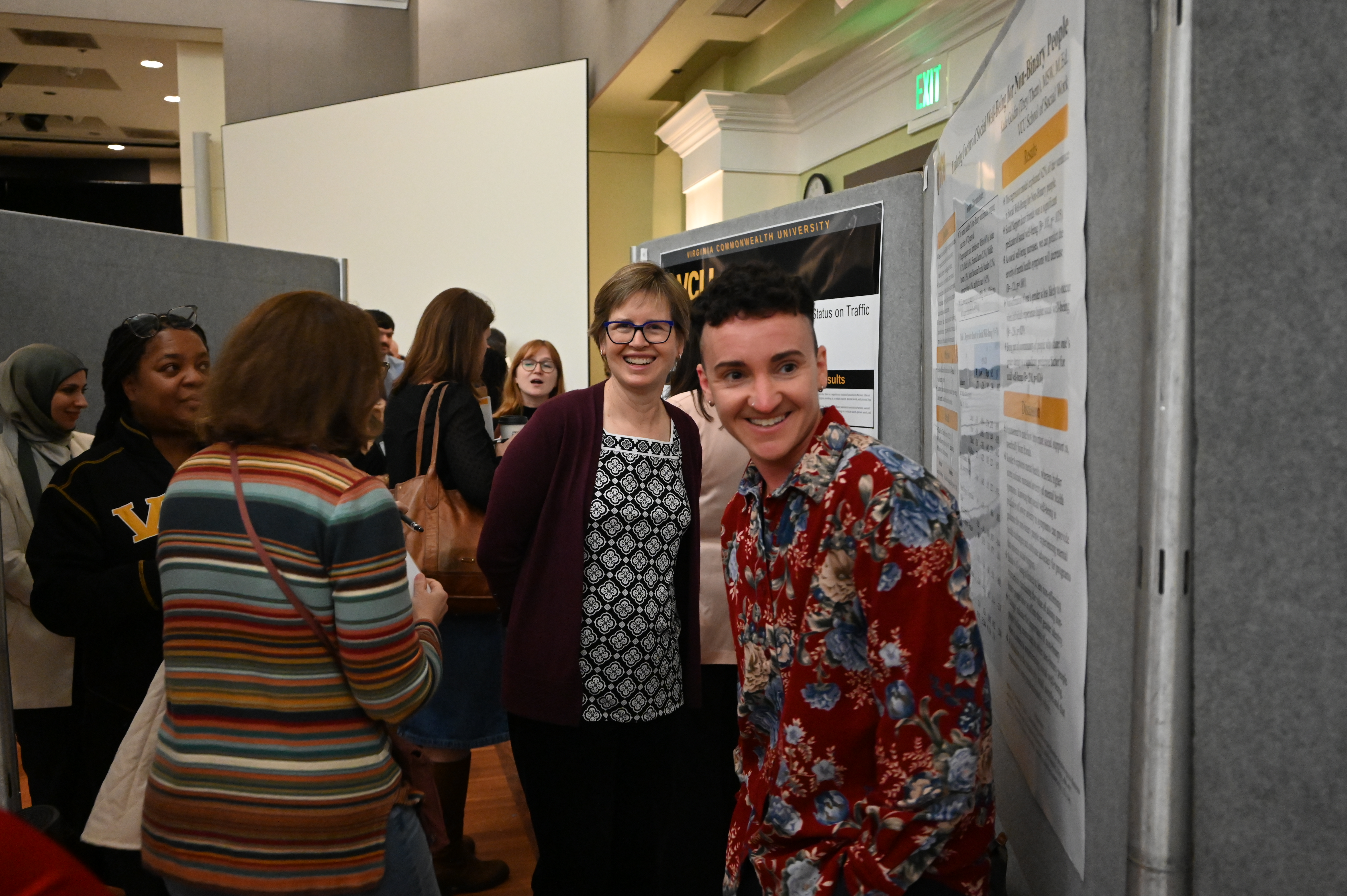 A student and a judge at the research symposium.