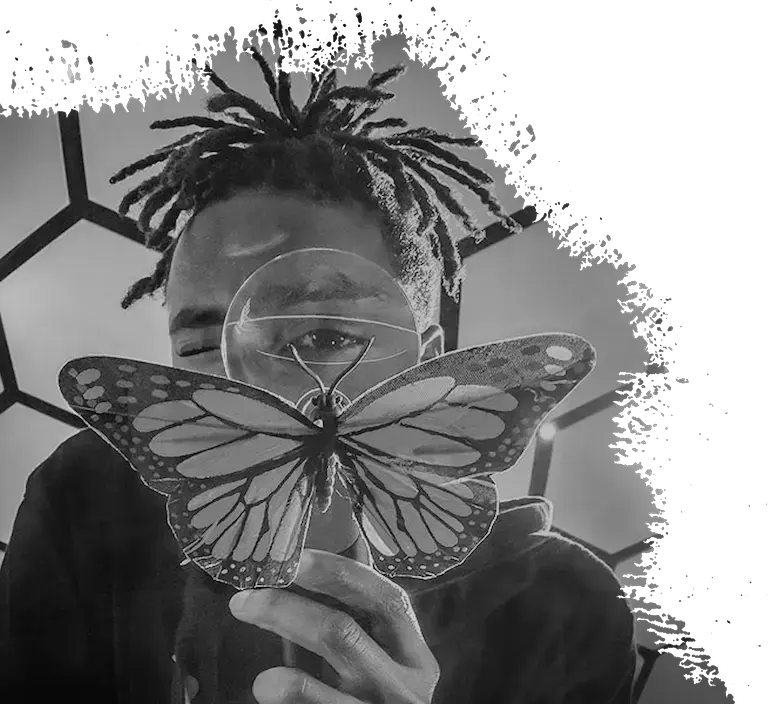 A person looking straight at the camera through a magnifying glass while observing a butterfly held partially in front of their face